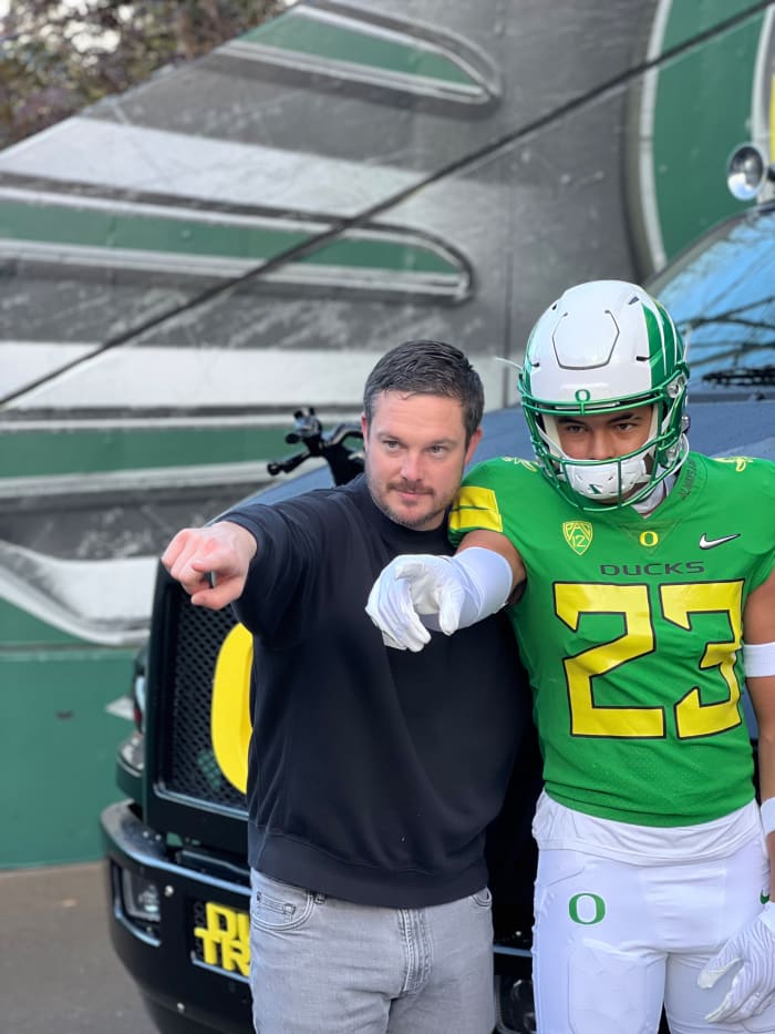 Marco Jones poses with head coach Dan Lanning during a trip to Eugene.